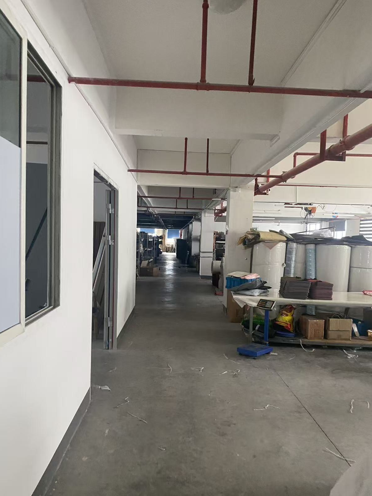 Workshop corridor with production equipment and material stock